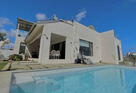 3-Bedroom House with Open Spaces, Garden, and Pool located in a secure gated estate
