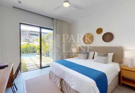 2-Bedroom Ground-Floor Apartment – Refined Island Living with Private Garden and Pool