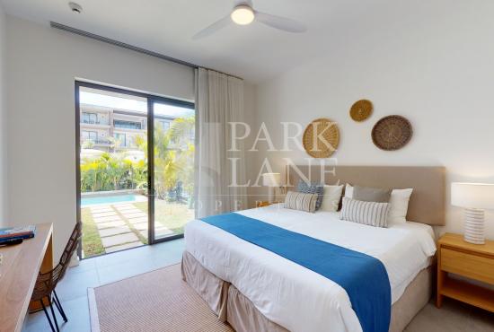 2-Bedroom Ground-Floor Apartment – Refined Island Living with Private Garden and Pool