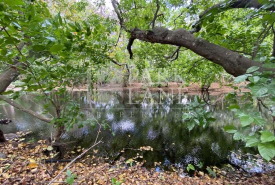 Serene Plot in Private Tamarin Estate with River Feature and Mountain Backdrop